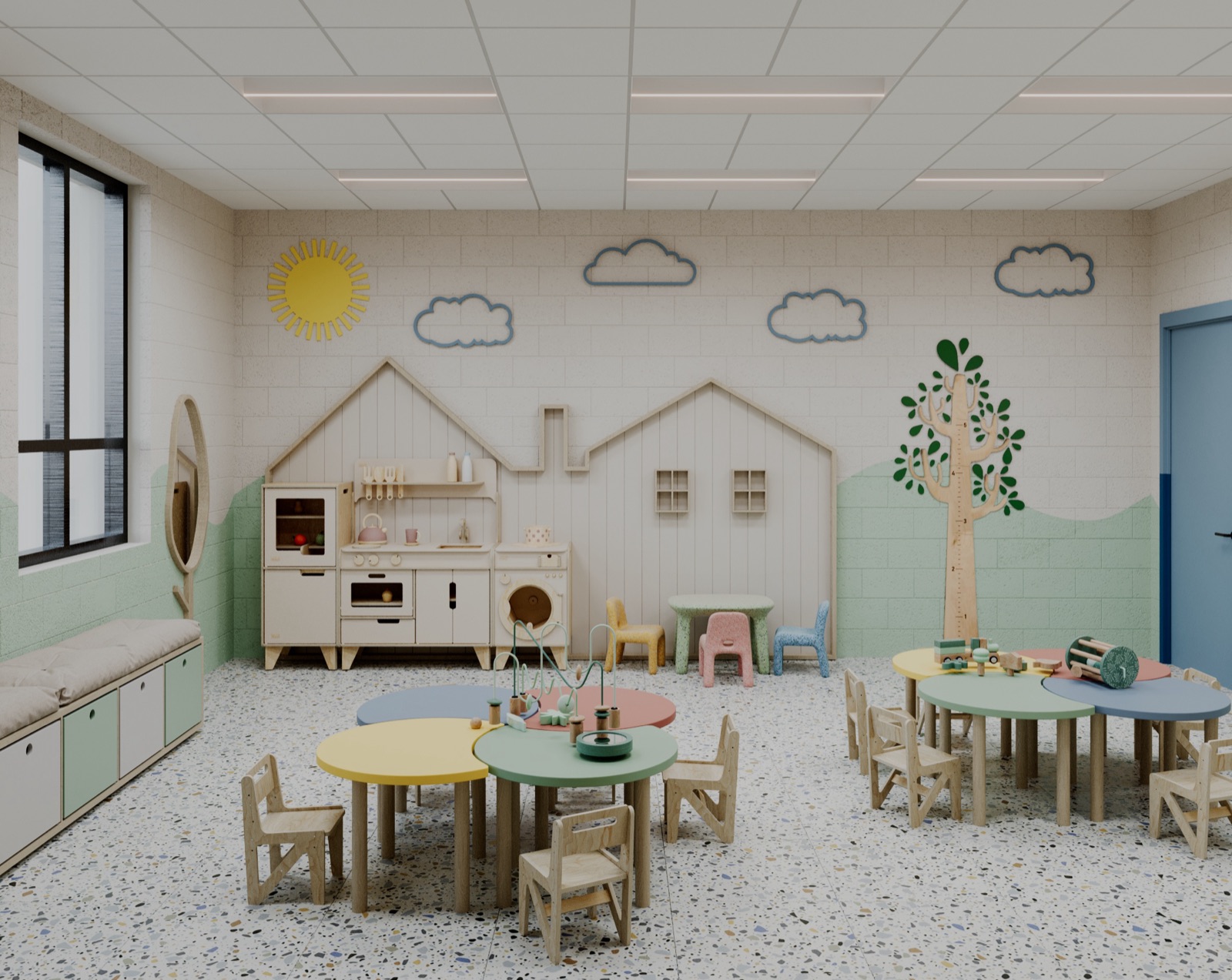 A childcare room in the new center: low round tables, a play kitchen and a sun on the wall